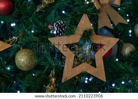 A close-up picture of decorations hung on a Christmas tree.