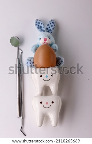 Happy easter.Stomatology concept.eggs, dentist tools and teeth figurines dentist. Easter. dentist tools. dentistry. concept.

