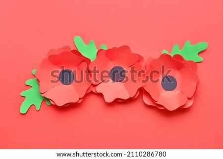 Remembrance Day in Canada. Red poppy flowers on red background