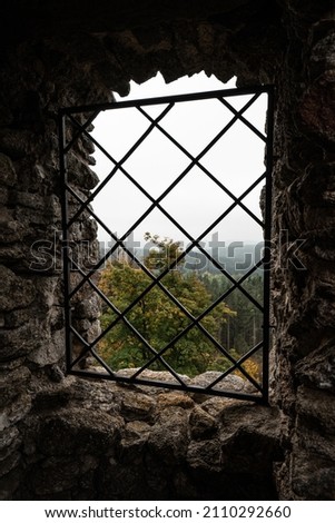 Window and bars at Vitkuv castle, Sumava mountains, Czech republic