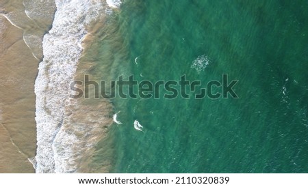 Aerial view of an emerald green sea and big foaming waves. Indian Ocean. Dikwella beach. Sri Lanka. High quality photo