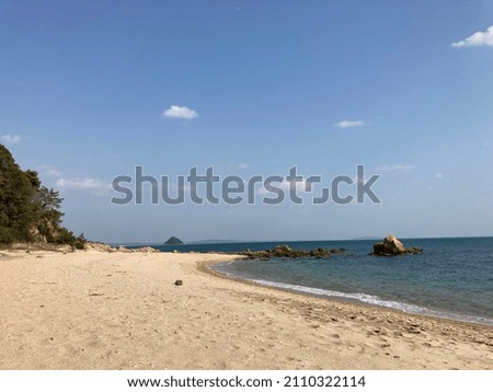 This is a picture of a sandy beach and rocks.