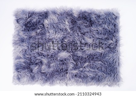 horizontal banner of a carpet with purple fur close-up. Design concept.Texture of a purple corner carpet. textile material macro close-up.The color of 2022 very peri. Flat lay, top view, copy space Royalty-Free Stock Photo #2110324943