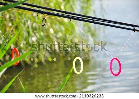 fishing tackle arranged on the shore of the lake. fishing. sports.
