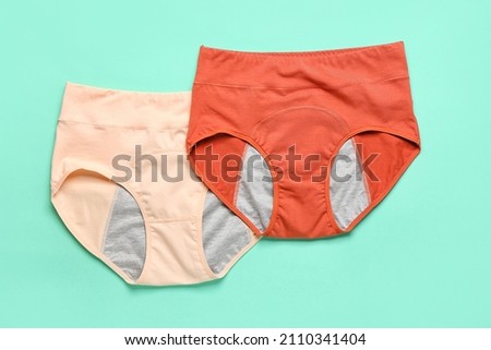 Period panties on color background Royalty-Free Stock Photo #2110341404