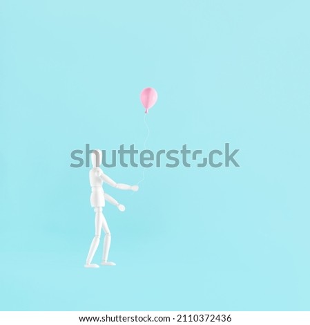 Man who holding a balloon. 