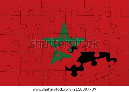 World countries. Broken puzzle- background in colors of national flag. Morocco