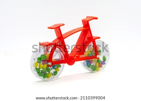 Isolated plastic toy bicycle in white