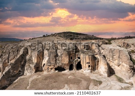 Historical ancient Phrygian (Phrygian Valley, Gordion) Valley. The valley is a popular tourist attraction. Arog movie was shot in these rocks and caves. Aerial view,  Afyon - TURKEY. Royalty-Free Stock Photo #2110402637