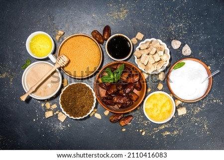 Various healthy diet replacement for sugar, natural organic sweetener concept, anti diabetes non-glycemic,  sweetener. Various fruit sugar, molasses, stevia, dates, coconut date sugar, maple syrup Royalty-Free Stock Photo #2110416083