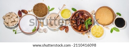 Various healthy diet replacement for sugar, natural organic sweetener concept, anti diabetes non-glycemic,  sweetener. Various fruit sugar, molasses, stevia, dates, coconut date sugar, maple syrup Royalty-Free Stock Photo #2110416098
