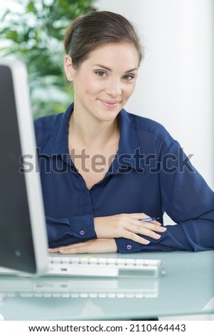 happy office worker looking at camera