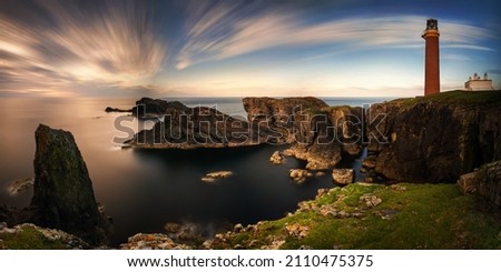 Panorama of Butt of Lewis lighthouse on high cliffs in sunset light, Scotland Royalty-Free Stock Photo #2110475375
