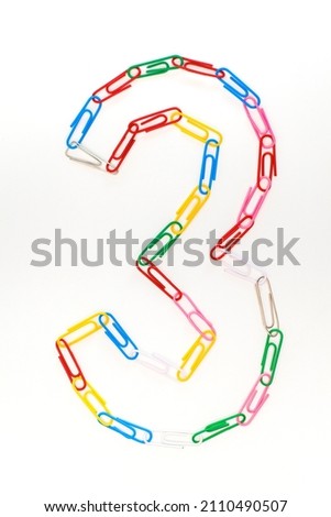 Figure number three from colored school paper clips on a white background Royalty-Free Stock Photo #2110490507