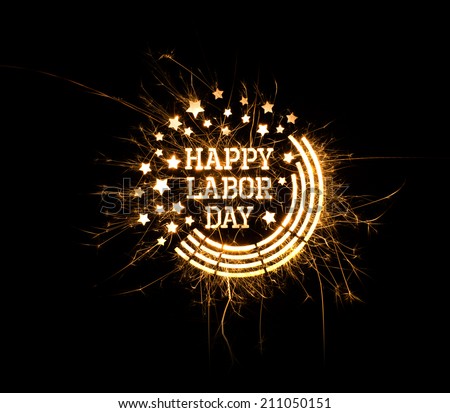 Happy Labor Day greeting done using sparklers on black background with copy space. Royalty-Free Stock Photo #211050151