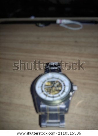 defocused A watch or watch is a timepiece worn on the human wrist with an ever-increasing display of time. The main use of a watch is to show the time when it is Royalty-Free Stock Photo #2110515386