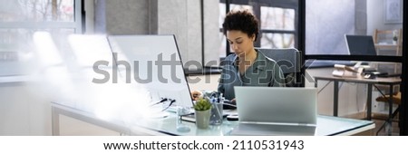 African Accountant Woman In Office Using Computer