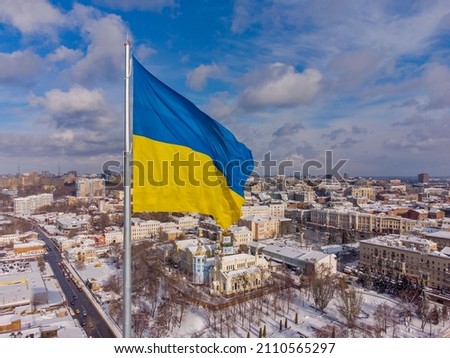 Ukrainian flag in the wind. Blue Yellow flag in the city of Kharkov. Royalty-Free Stock Photo #2110565297