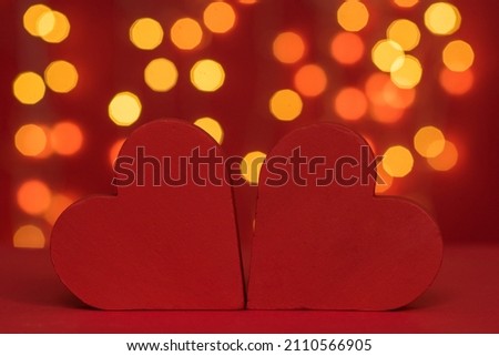 Two red hearts, valentine's day card. bokeh background, postcard for February 14