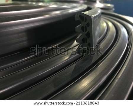 Extruded and wrapped rubber profile... Rubber profile section Royalty-Free Stock Photo #2110618043
