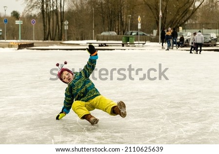 little boy slipped on the ice on the lake in Druskininkai	