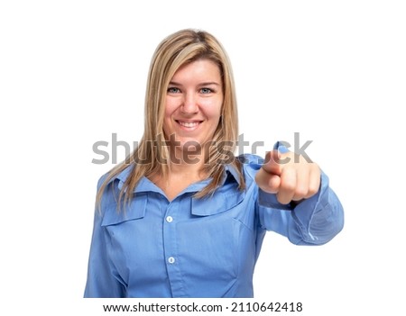 Smiling young woman pointing with index finger at camera isolated on white background