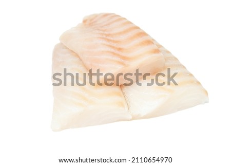 Raw pieces of cod fish loins isolated on white background. Royalty-Free Stock Photo #2110654970
