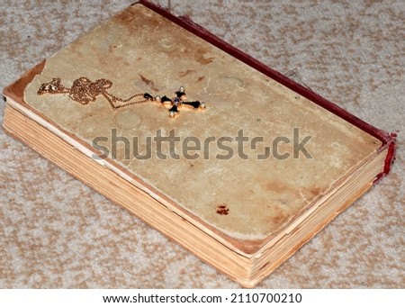 orthodox christian cross on an old book