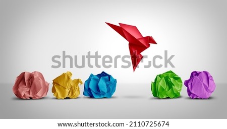 Concept of new idea and creative thinking as a symbol of innovation and inspiration metaphor as a group of crumpled papers with one different paper transforming into an origami bird in flight.  Royalty-Free Stock Photo #2110725674