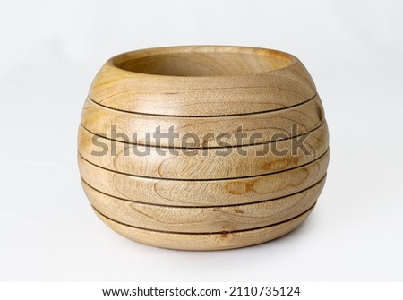 Empty wooden bowl isolated on white background.