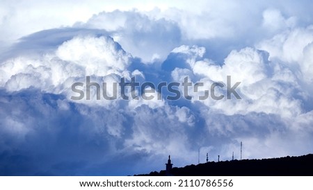 View of an impressive cloud above a mountain