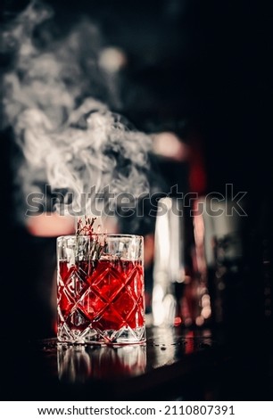 glass cocktail in bar with smoke Royalty-Free Stock Photo #2110807391