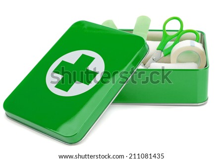 An open first aid kit with contents on a white background