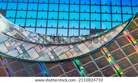 Silicon Wafers with microchips used in electronics for the fabrication of integrated circuits Royalty-Free Stock Photo #2110824710