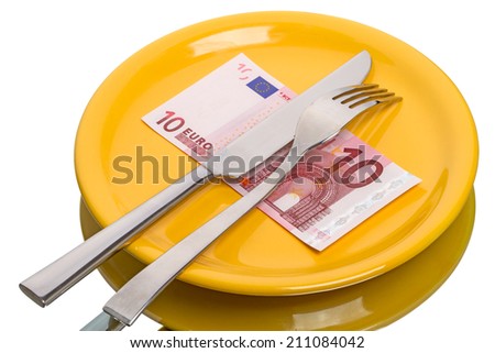 Fork, knife on yellow plate and and ten euro isolated on white background