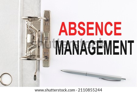ABSENCE MANAGEMENT text on paper folder with pen. Business concept