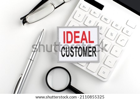 IDEAL CUSTOMER text on sticker with calculator, glasses and magnifier