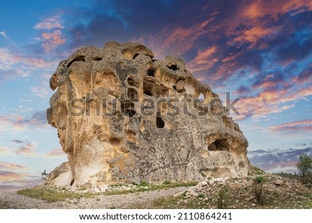 Avdalaz Castle, located in the Ayazini village of the İhsaniye district of Afyonkarahisar in the Phrygian (Frig) Valley is important with its 5-storey architectural structure carved into the tuff rock Royalty-Free Stock Photo #2110864241