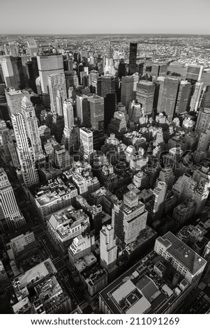 Aerial view of New York cityscape from Manhattan's Midtown East and Upper East Side to Queens in the background. Black & White Vertical New York. Urban view of NY  skyscrapers seen from above.