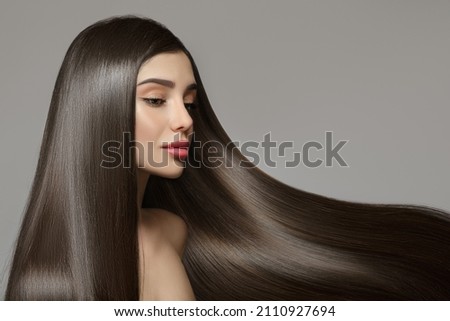 Fashion woman with straight long shiny hair. Beauty and hair care Royalty-Free Stock Photo #2110927694