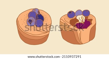 Multicolored doodle. A set of two cupcakes with a brown outline with blueberries and blueberry cream. Vector