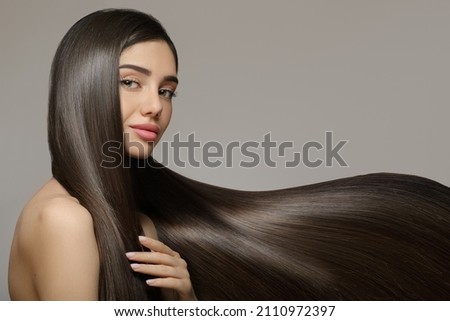 Fashion woman with straight long shiny hair. Beauty and hair care Royalty-Free Stock Photo #2110972397