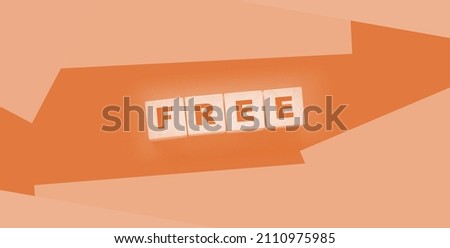 the word free on wooden blocks on black background. Business concept