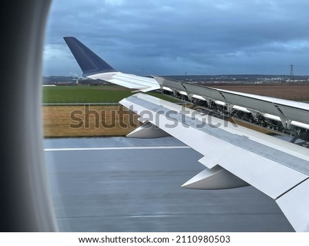 View from the landing window of the new Airbus, a new generation commercial aircraft for holiday tourism that pollutes less and consumes less fuel, ideal for the aviation industry.