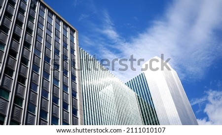 Daytime Establishing Photo of Corporate Buildings against Blue Sky Royalty-Free Stock Photo #2111010107