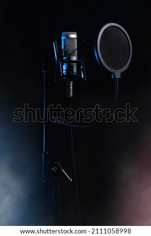 Microphone. condenser microphone. Black microphone. Banner. vertical photo
