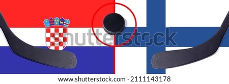 Top view hockey puck with Croatia vs. Finland command with the sticks on the flag. Concept hockey competitions