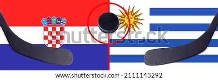 Top view hockey puck with Croatia vs. Uruguay command with the sticks on the flag. Concept hockey competitions