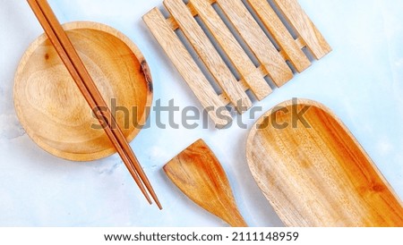 Wooden kitchenware that gives a classic and minimalist impression. Food and drink concept. Food Photography. Flat Lay, Close up Wooden Bowl on the table.