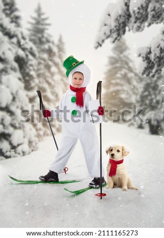 A boy in a snowman costume on skis holds a letter in the hands of a rod dog. Picture from the fairy tale snowman postman.